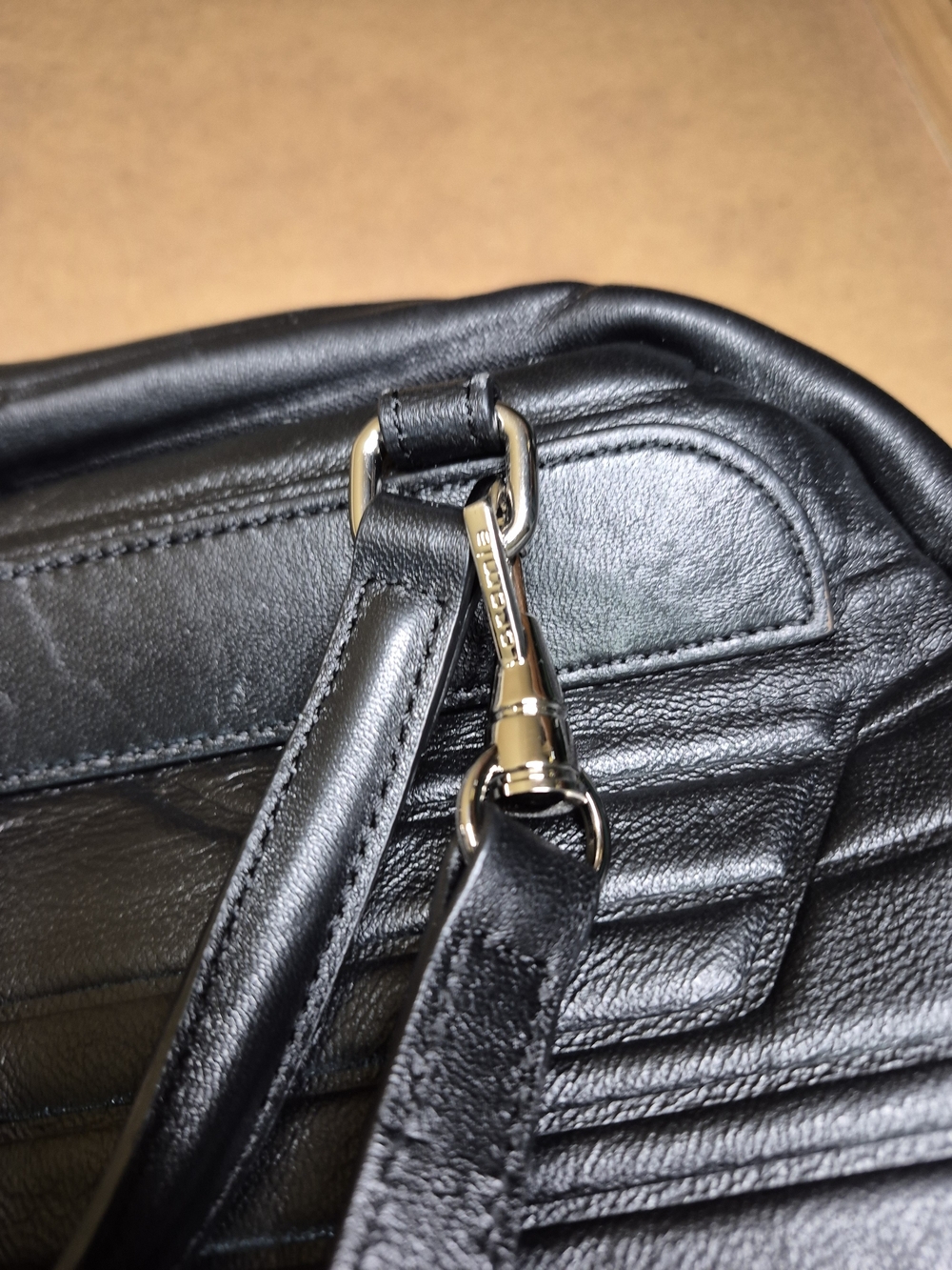 Black Quilted Leather Backpack with Polished Metal Clasp - Picture 9 of 11